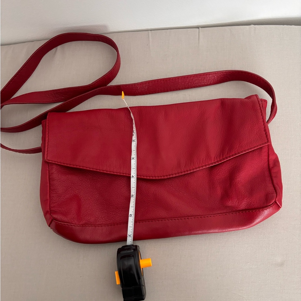 Red leather crossbody bag with adjustable strap